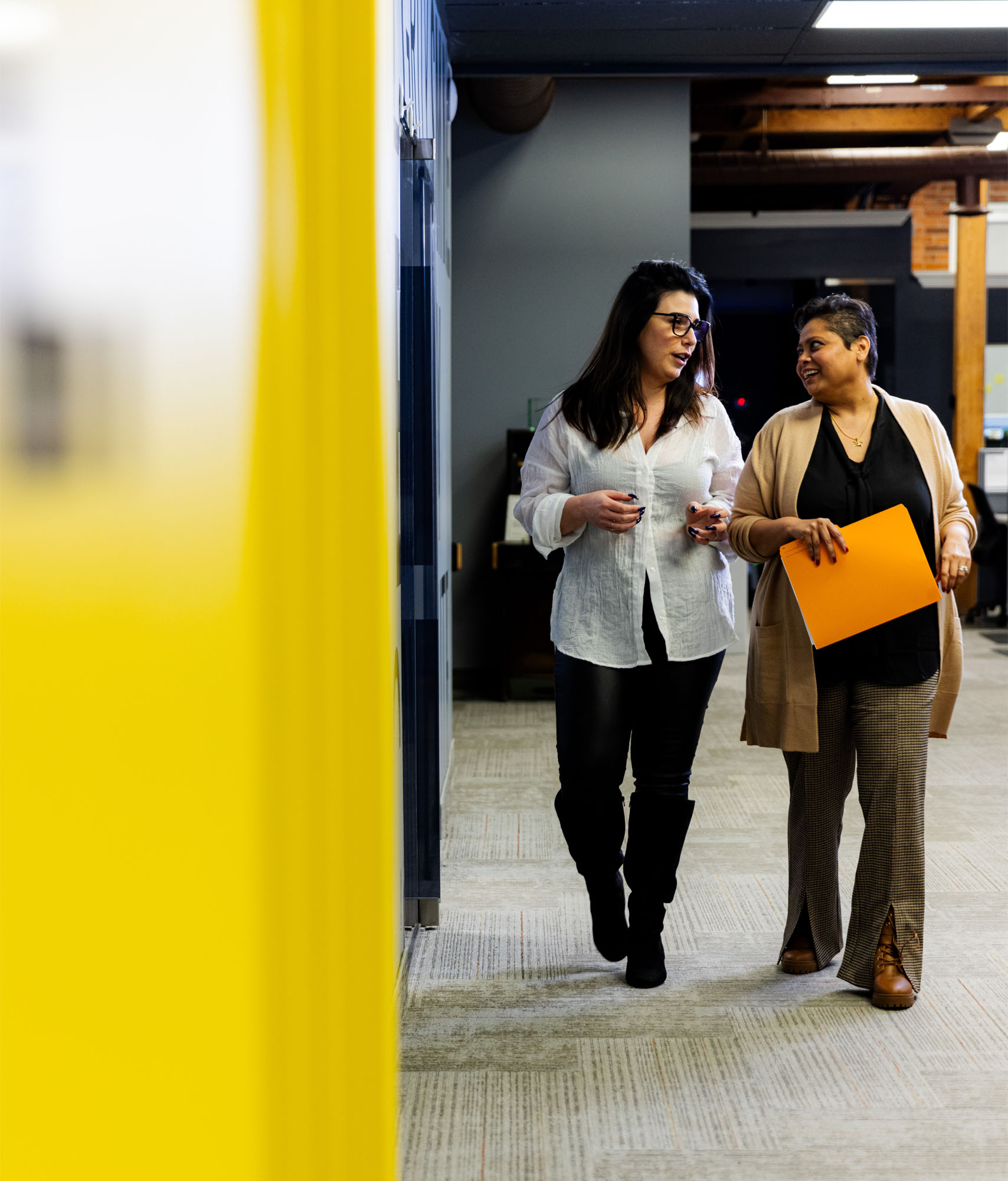Elisha and Salina walking in AnswerPlus' office in Hamilton Onatio