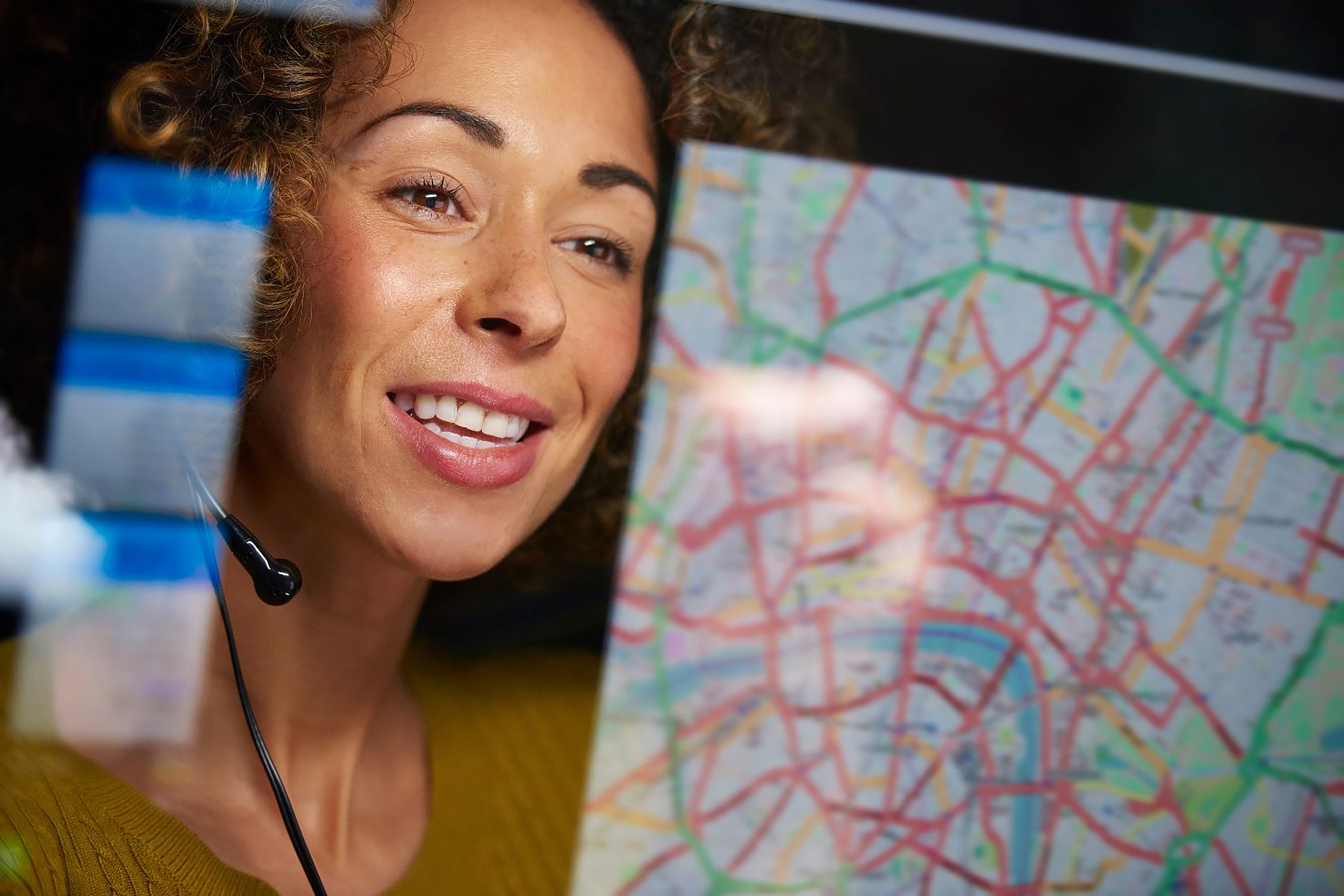 Woman working on a computer with vehicle routing software