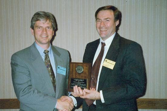 Paul receiving CamX Award